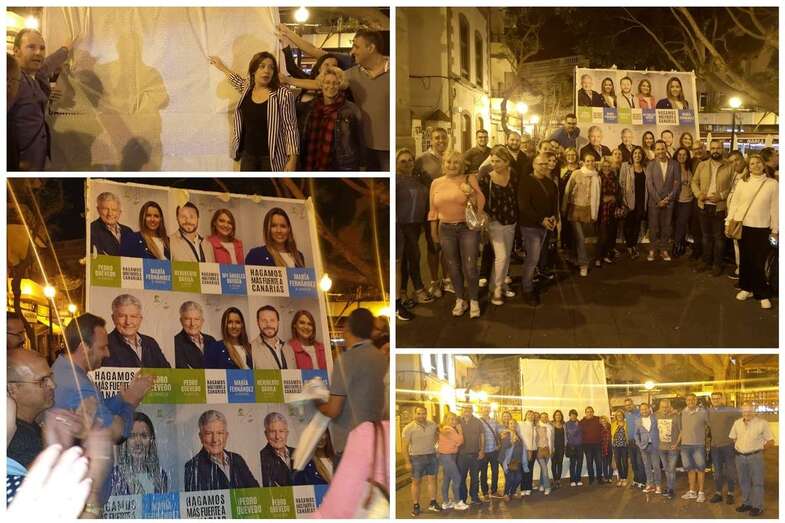 Nacionalistas ante sus carteles electorales, anoche en la plaza de Los Llanos (Foto TA)